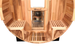 Zoppinh Blisspod Prague Canadian Red Cedar outdoor steam barrel sauna in a backyard setting with lush greenery
