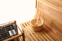 Zoppinh Blisspod Prague Canadian Red Cedar outdoor steam barrel sauna with wooden exterior and traditional sauna door.