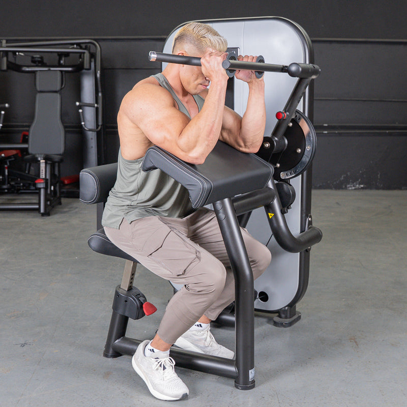 Muscle D Fitness Vogue Biceps and Triceps Combo selectorized machine with padded handles and adjustable weights for arm workouts.
