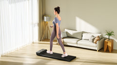 Foldable KingSmith WalkingPad A1 Pro treadmill for under desk use, showcasing its compact, sleek design and control panel.