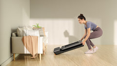 Foldable Kingsmith WalkingPad A1 Pro treadmill for under desk walking, shown in a compact, folded position.