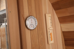 Zoppinh Blisspod Prague Canadian Red Cedar outdoor steam barrel sauna with wooden exterior and open door showing interior seating.