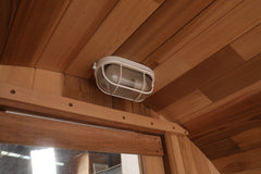 Zoppinh Blisspod Prague Canadian Red Cedar outdoor steam barrel sauna with wooden exterior and glass door for outdoor relaxation.