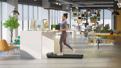 Foldable Kingsmith WalkingPad A1 Pro treadmill for under desk use, with a sleek black design and compact folding feature.