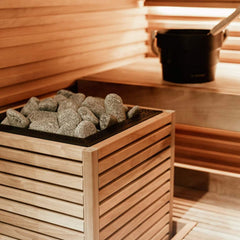 SAKSBY WHOLESALE Huum Core Thermo Aspen Wood Exterior Sauna Heater, 6.5kW to 10.5kW, with visible wood exterior and control panel.