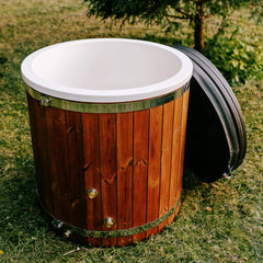 Premium 1-person ThermoWood Cold Plunge Tub by SAKSBY WHOLESALE, fully assembled, outdoors with water inside, no cover visible.