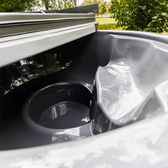 Inside view of a fully assembled SAKSBY WHOLESALE Premium 4-person ThermoWood wood-fired hot tub with cover.