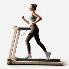 WalkingPad Denise Austin 2.0 foldable treadmill in taupe, with a blue control panel and compact design for home use.