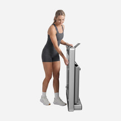 WalkingPad X214 foldable treadmill for exercise and fitness, showing its compact design and control panel in a home gym setting.