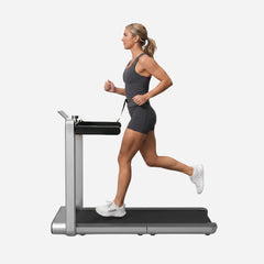 WalkingPad X214 foldable treadmill for walking and running, black exercise machine with digital display and safety handrails.