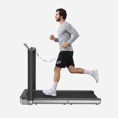 WalkingPad X25 double-fold running treadmill for exercise and fitness, shown in a lifestyle setting with sleek design and digital display.