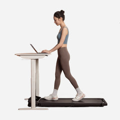 WalkingPad Z3 Hybrid+ foldable treadmill for walking and running, shown in a modern office setup with digital display and safety features.