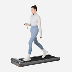 WalkingPad Z3 foldable treadmill in a home gym setting, showcasing its sleek design and compact size for easy storage and exercise.