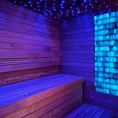 SAKSBY WHOLESALE Prosaunas Himalayan Salt Sauna Wall Kit with blue LED lighting, customizable sauna wall panels for relaxation.