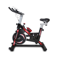 Side view of Rovix indoor exercise spin bike by Saksby Wholesale with a cushioned seat and adjustable handlebars.