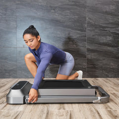 WalkingPad R2 Walk&Run 2-in-1 foldable treadmill in a home workout space, showcasing its compact design and foldable storage.