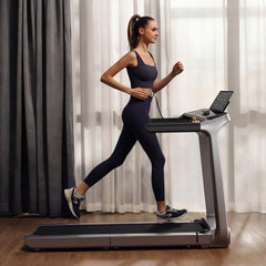 WalkingPad X218 foldable treadmill in a living room setting, showcasing its compact design and digital display for home exercise.