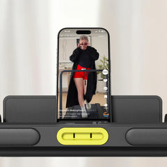 WalkingPad Z3 Hybrid foldable treadmill with phone holder, compact exercise and fitness equipment in a home gym setting.
