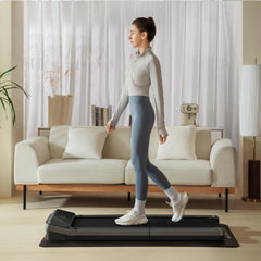 WalkingPad Z3 foldable treadmill in a living room setting, compact exercise equipment for walking and fitness at home.