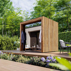 Outdoor 4-person sauna cabin by ThermaSol Fortis, fully assembled with wooden interior and exterior in a natural setting.