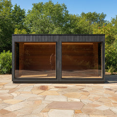 Front view of Saksby Wholesale ThermaSol Nordic Misty XL Lounge outdoor sauna cabin with two entrances, showcasing its wooden exterior.