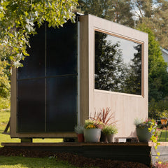 Outdoor sauna cabin by Saksby Wholesale, fully assembled ThermaSol Solaris sauna for 2-5 people, with wooden exterior and glass door.